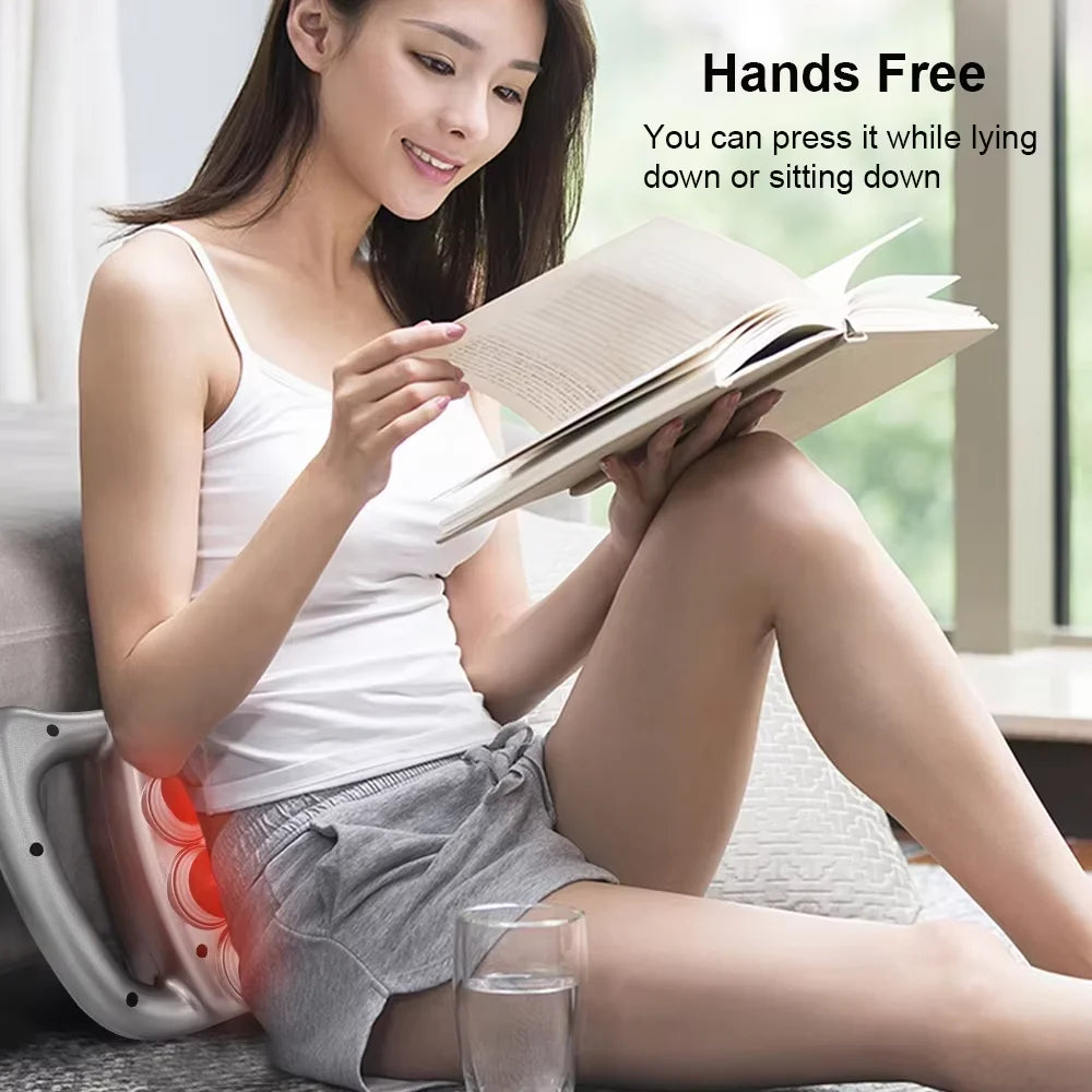 Woman using professional fascia gun on upper back muscles for deep tissue massage and myofascial release therapy